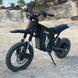 All-black freego-x0 electric mini dirt bike (for teens/adults) with rugged tires, front suspension, and "Freego" branding, positioned on gravel terrain.