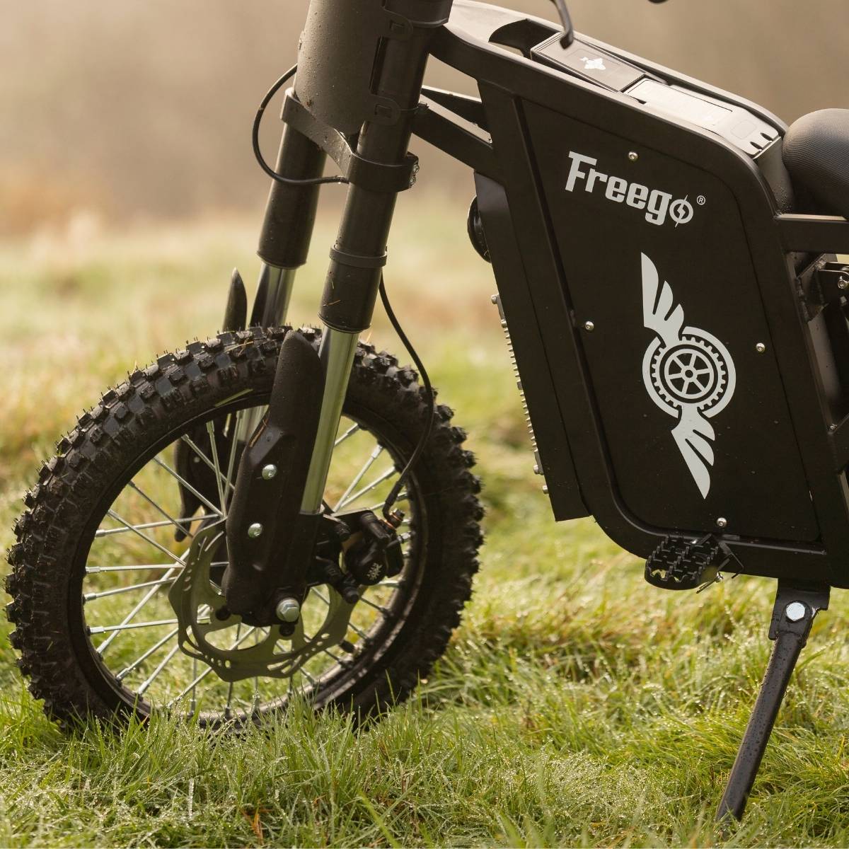 Front angle of the Freego X0 showing the dual-crown suspension fork and front disc brake.